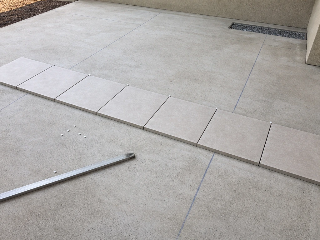 how to lay tiles on concrete patio